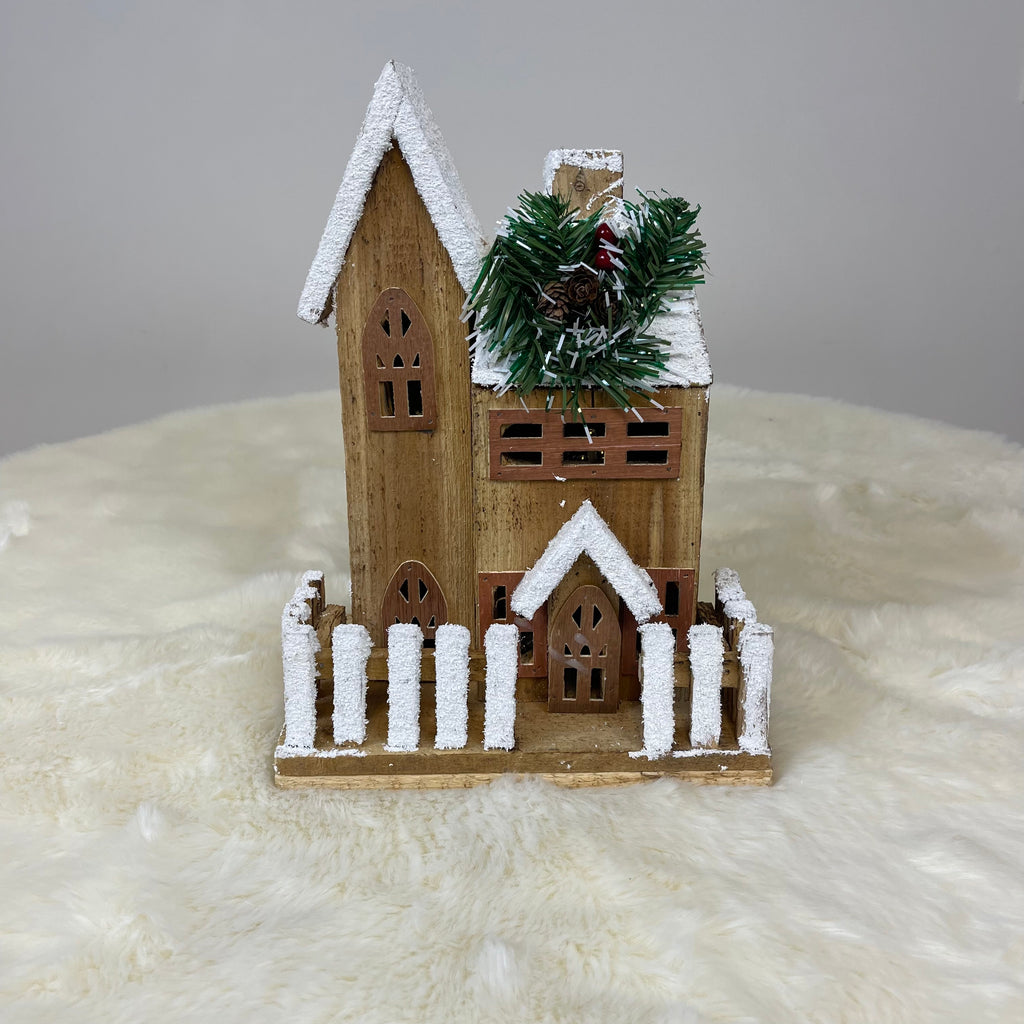 Wooden Christmas Lodge with Lights Inside